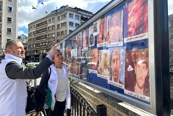 Karla Quintana (centre), head of the Independent Institution on Missing Persons in Syria, visits Al Marjeh Square in Damascus, a place where families of missing persons display photos in the hope of finding their loved ones.